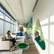 pediatric waiting room engaging school-age children while a mother relaxes